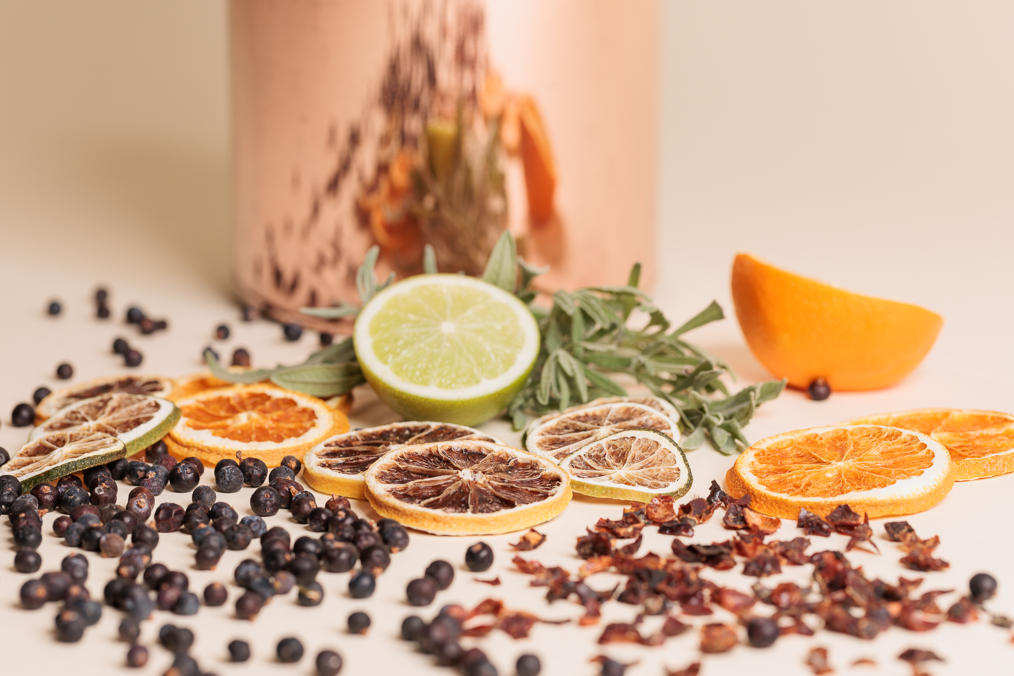 Image of fresh and dried botanicals, citrus, juniper berries.